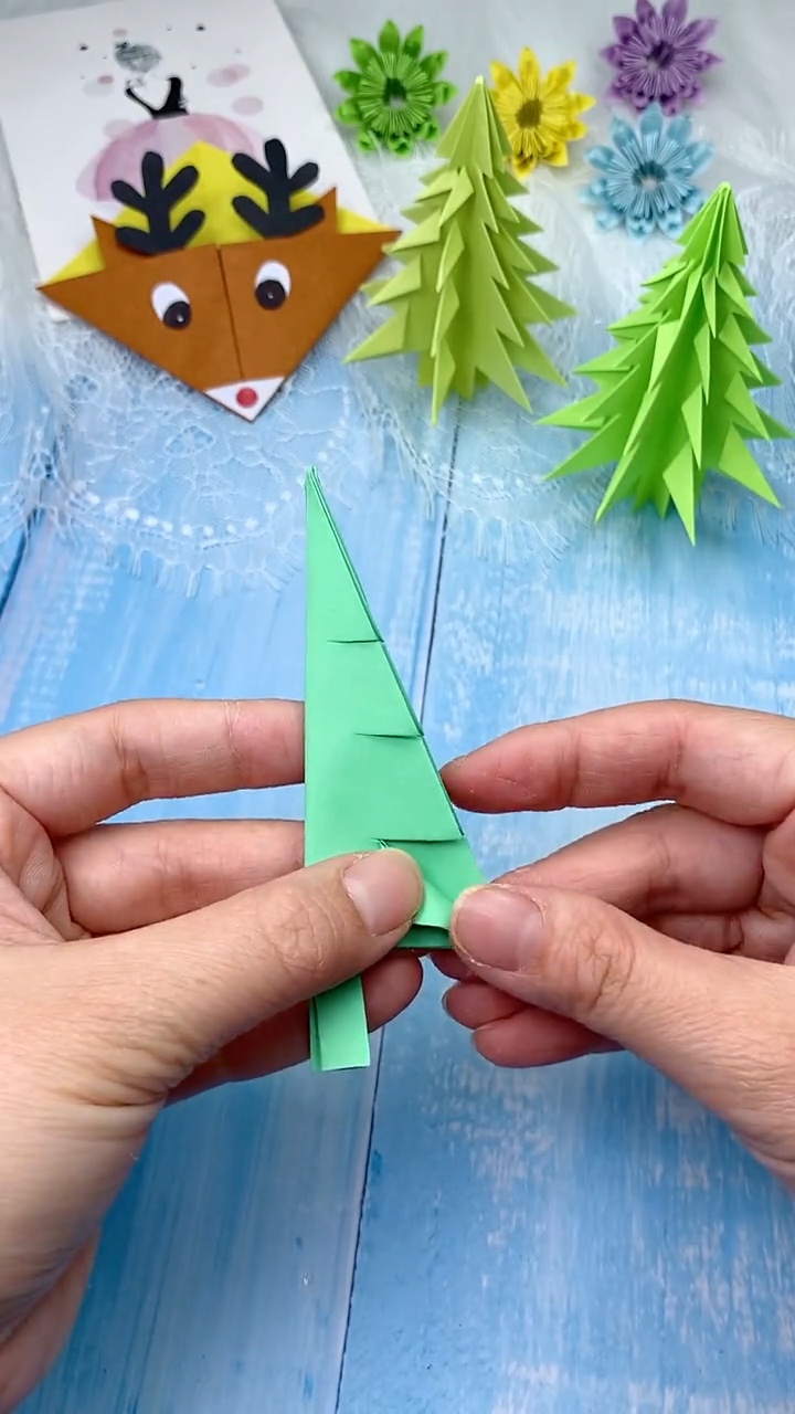 Step 5 Making Parallel Horizontal Scissor Cuts Along Both Sides for Tree Boughs