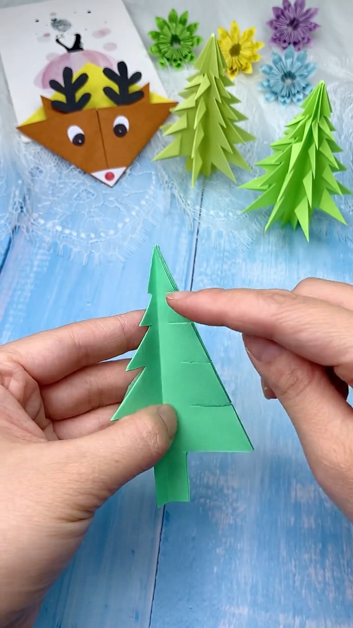 Step 6 Folding Each Cut Branch Flap Downward and Fanning Out into 3D Standing Tree