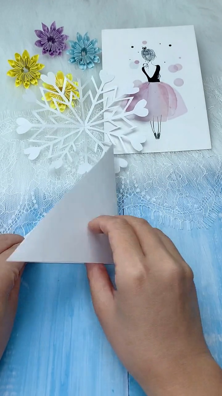 Step 1 Folding White Square Craft Paper Diagonally into a Triangle