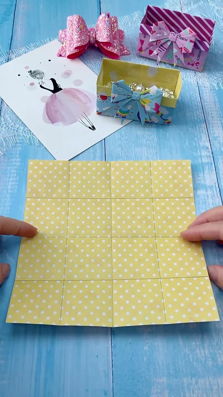 Step 1 Folding and Creasing 4x4 Grid on Decorative Origami Paper