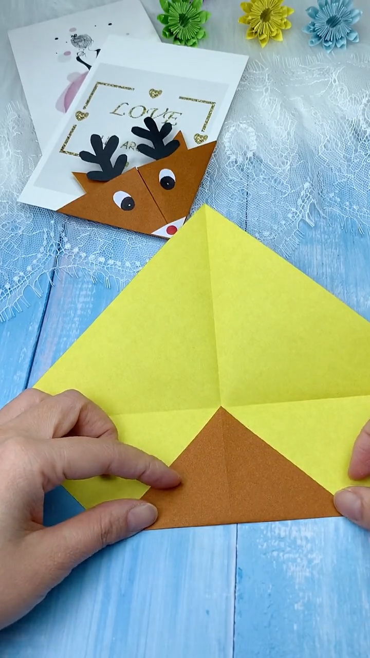 Step 1 folding square paper into triangle base