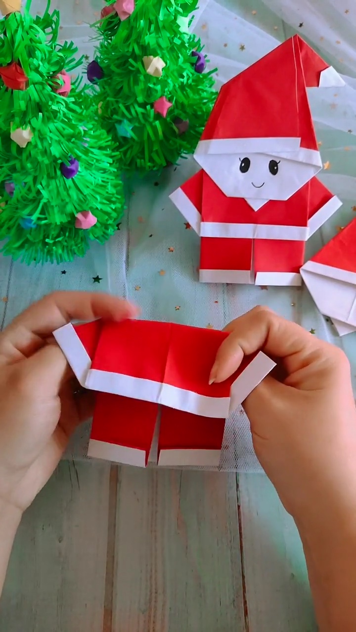 Step 5 Folding Paper Inward to Shape Coat Sleeves and Pants