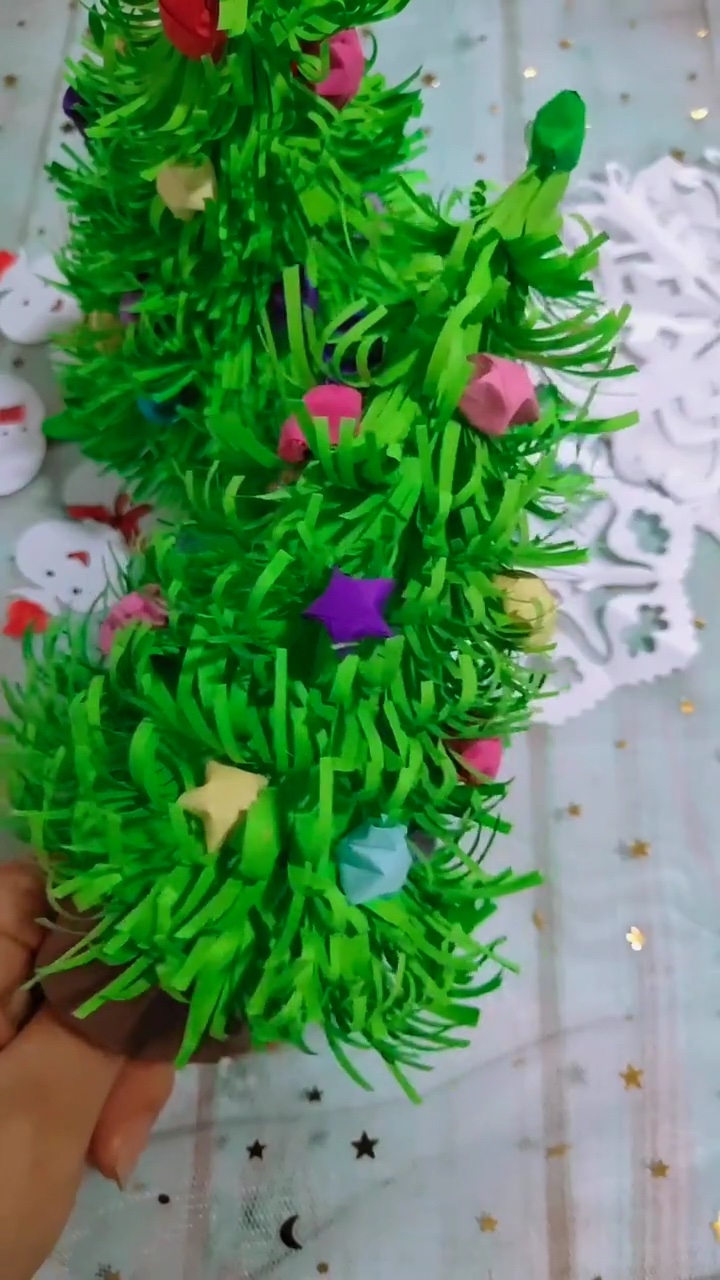 Bushy Green Paper Christmas Tree Adorned with Colorful Origami Lucky Star Baubles
