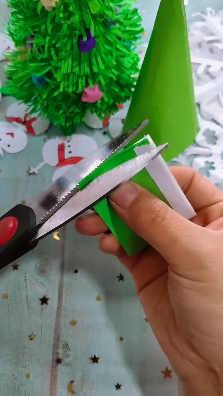 Step 2 Folding Green Paper Strips and Snipping Slender Pine Needle Fringe