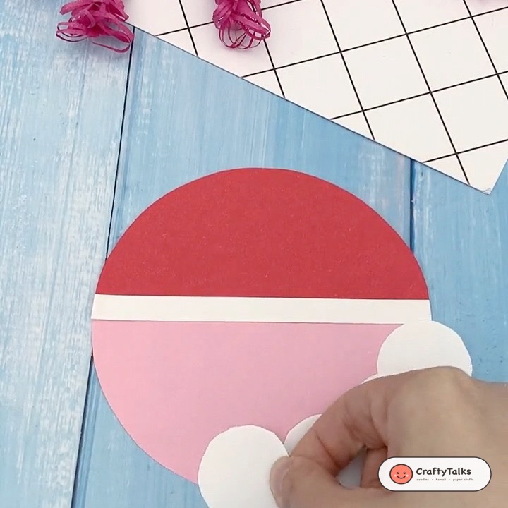 Step 3: Beginning first layer of overlapping white paper circles for scalloped Santa beard