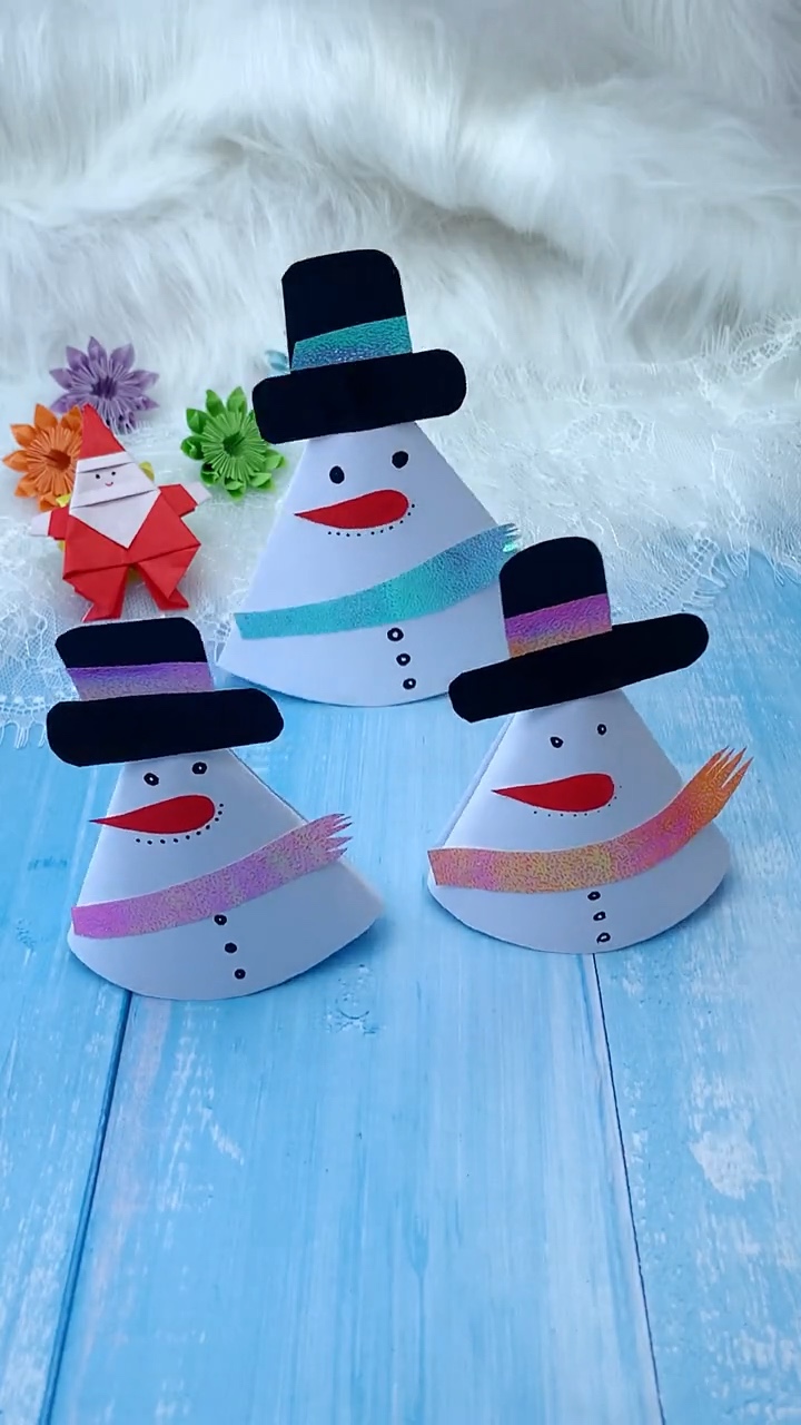 Trio of Colorful Paper Cone Snowmen Displayed with Origami Santa and Flowers