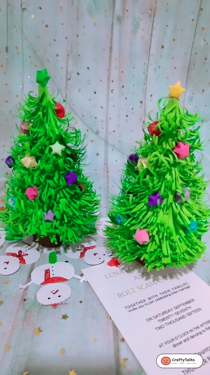 3D Fringed Paper Christmas Trees Decorated with Origami Stars on Tabletop